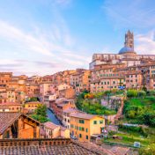 Downtown Siena skyline in Italy with blue sky